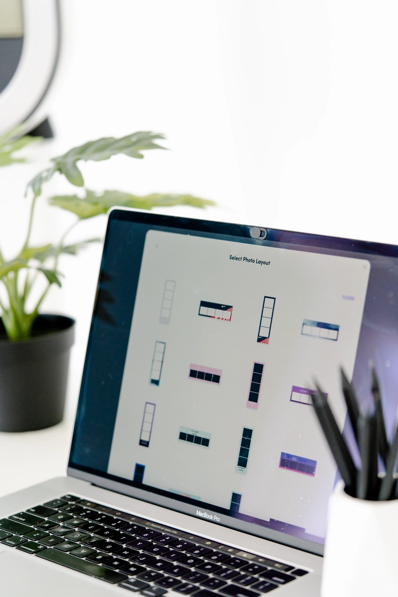 Custom photo booth template designs displayed on a laptop
